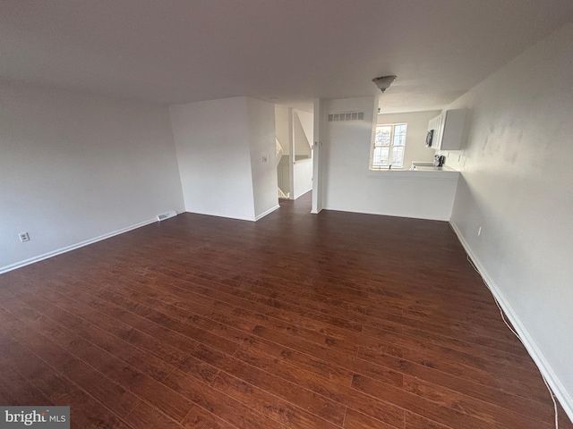 spare room with dark hardwood / wood-style floors