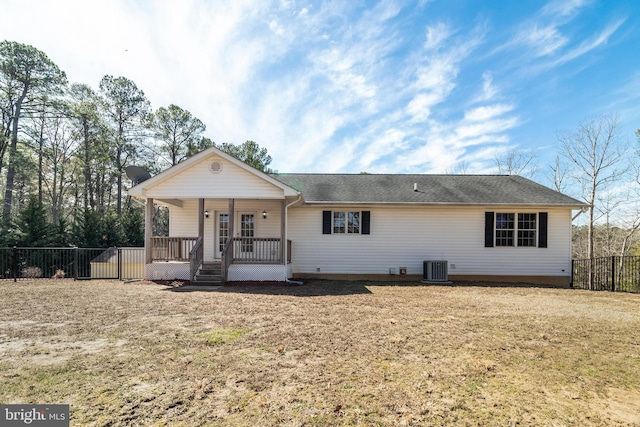 view of front of house with cooling unit, fence, and covered porch