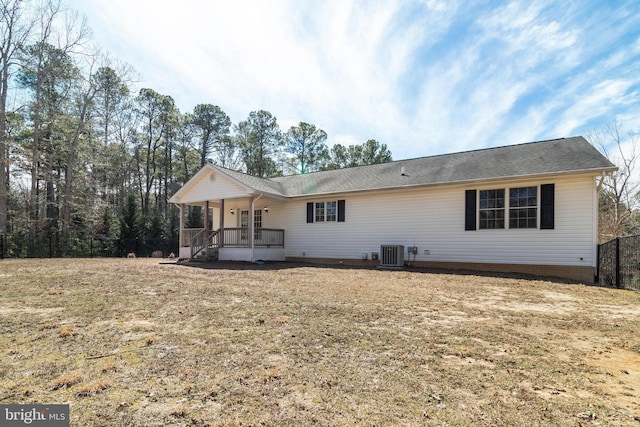 view of front of house featuring a porch and central air condition unit