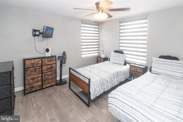 bedroom with hardwood / wood-style flooring and ceiling fan