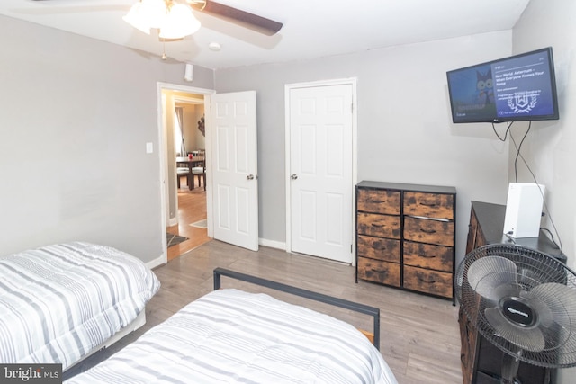 bedroom with hardwood / wood-style flooring and ceiling fan