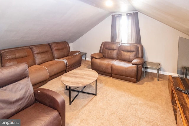 living room featuring light carpet and lofted ceiling