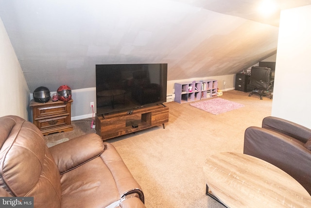 carpeted living room featuring lofted ceiling and a baseboard heating unit