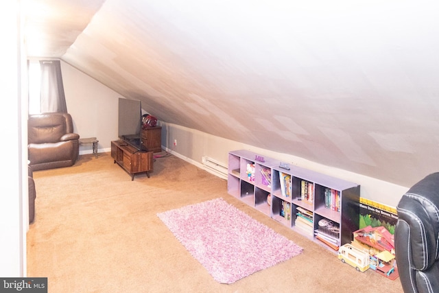 playroom featuring vaulted ceiling, light colored carpet, and a baseboard radiator