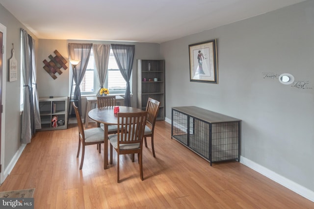 dining space featuring light hardwood / wood-style floors