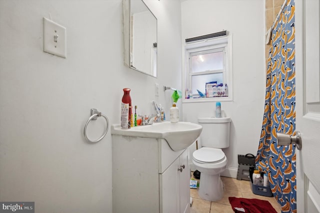 bathroom with vanity, tile patterned floors, and toilet