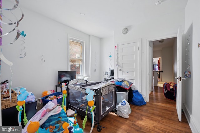 bedroom featuring dark hardwood / wood-style flooring