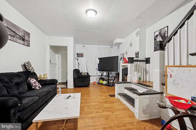 living room with light hardwood / wood-style flooring