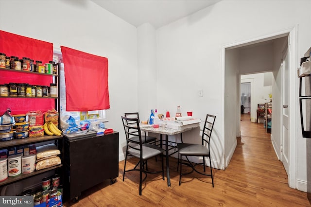 dining room with hardwood / wood-style floors