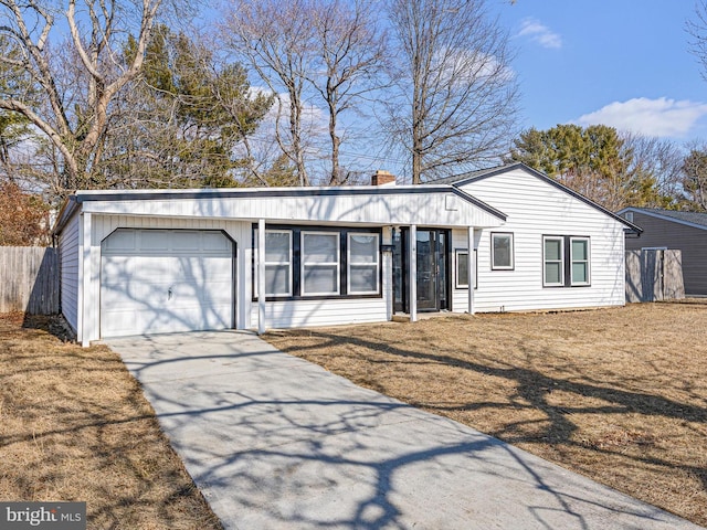 single story home with a garage and a front yard