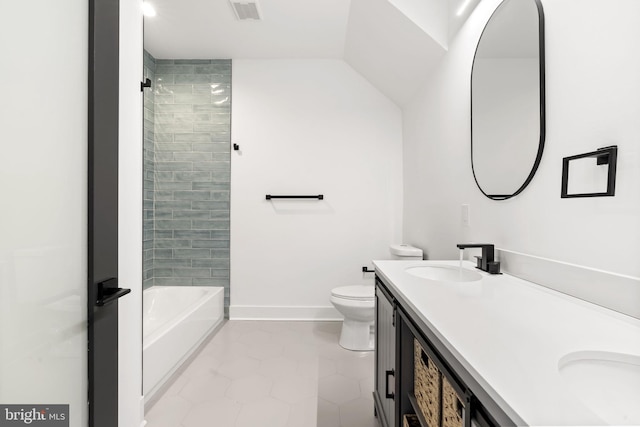 full bathroom with tiled shower / bath combo, vanity, and toilet