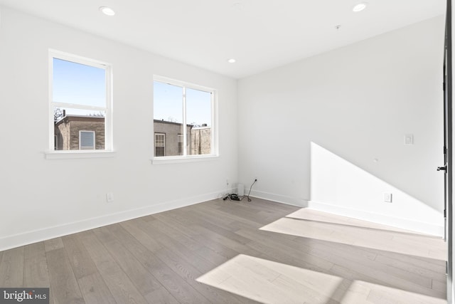 empty room with light hardwood / wood-style floors