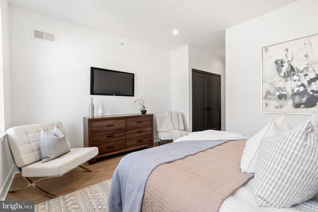 bedroom with light hardwood / wood-style floors