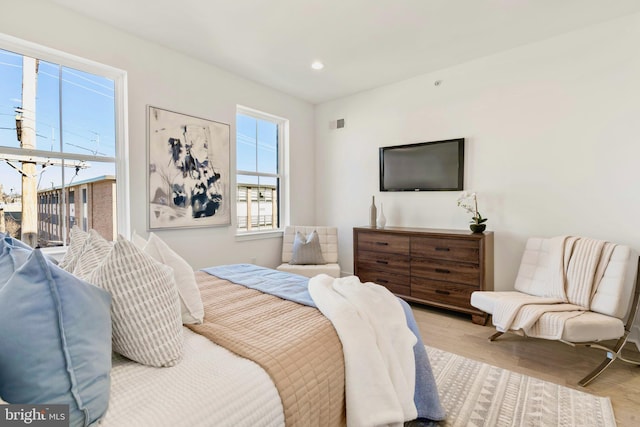 bedroom with light hardwood / wood-style floors