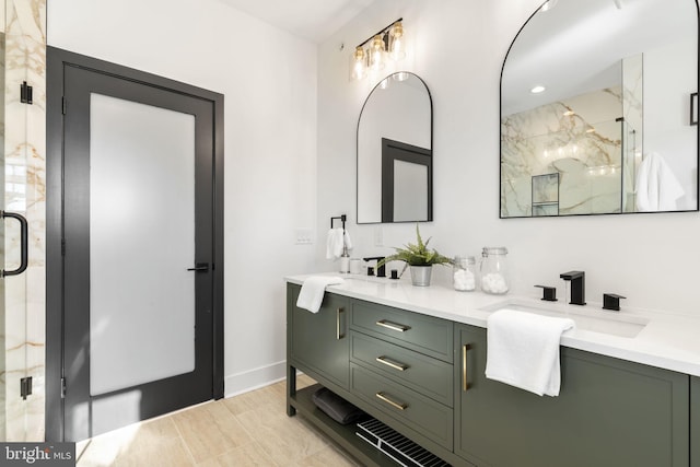 bathroom featuring vanity and a shower with door