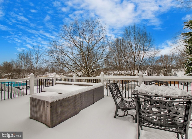 snow covered patio with a swimming pool