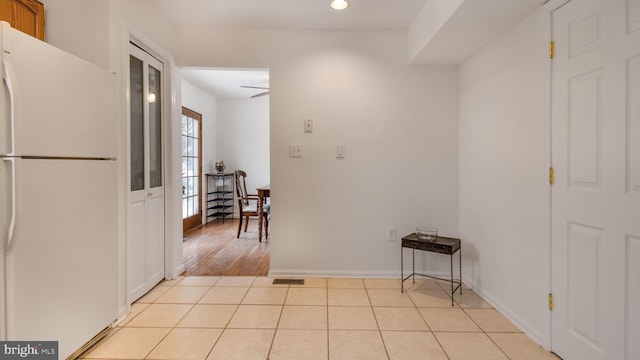 hallway with light tile patterned floors