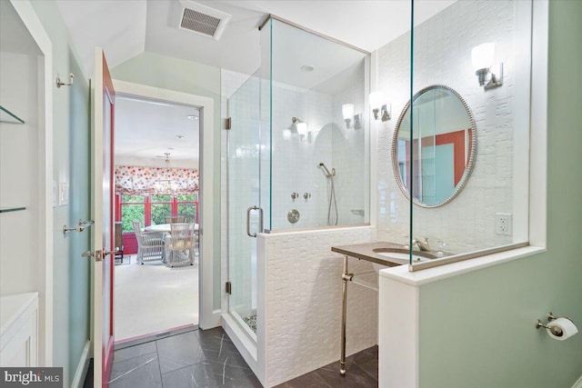 full bathroom featuring visible vents, a stall shower, vanity, and vaulted ceiling