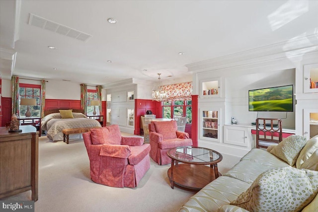 bedroom with a notable chandelier, visible vents, crown molding, and carpet floors