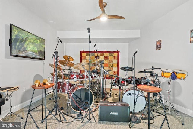 game room featuring a ceiling fan and baseboards