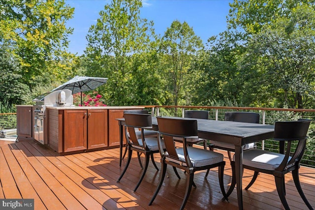 wooden deck with area for grilling and outdoor dining area