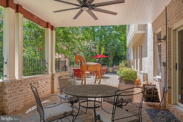 view of patio / terrace with outdoor dining area and ceiling fan