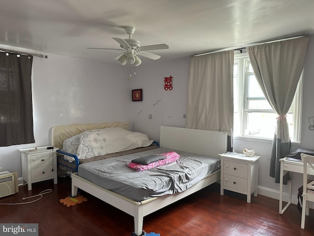 bedroom featuring ceiling fan and dark hardwood / wood-style floors