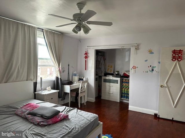 bedroom with ceiling fan and dark hardwood / wood-style flooring