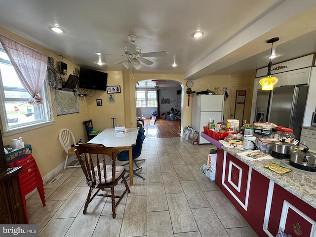 dining space with ceiling fan