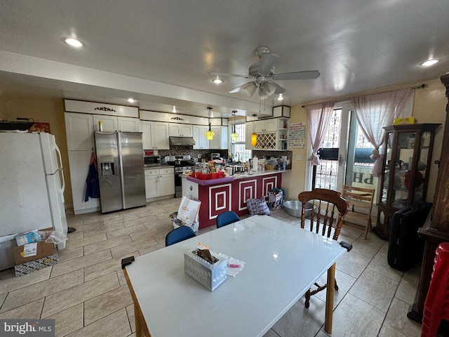 dining area featuring ceiling fan