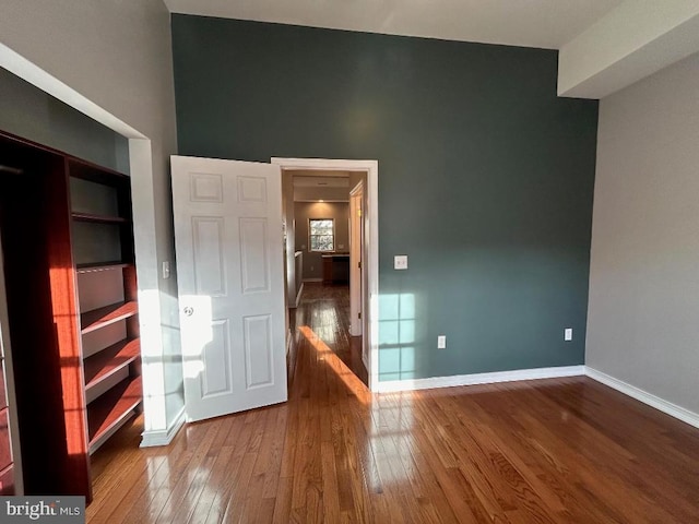 unfurnished bedroom with hardwood / wood-style flooring