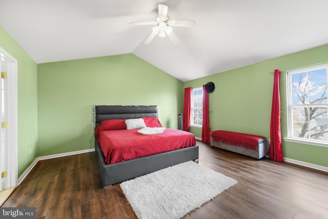 bedroom featuring vaulted ceiling, dark hardwood / wood-style floors, and ceiling fan