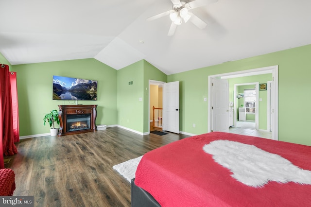 bedroom with vaulted ceiling, dark hardwood / wood-style floors, and ceiling fan