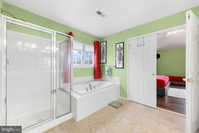 bathroom with plus walk in shower and tile patterned floors