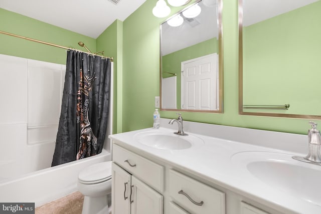 full bathroom with tile patterned flooring, vanity, shower / tub combo, and toilet