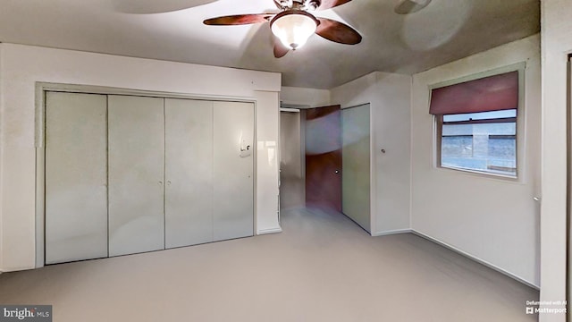 unfurnished bedroom featuring ceiling fan