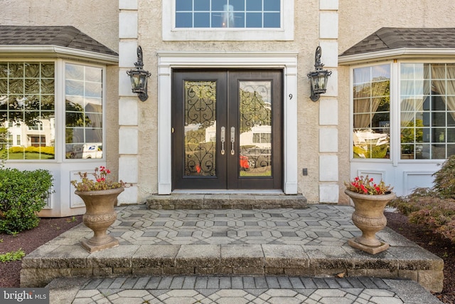 entrance to property featuring french doors