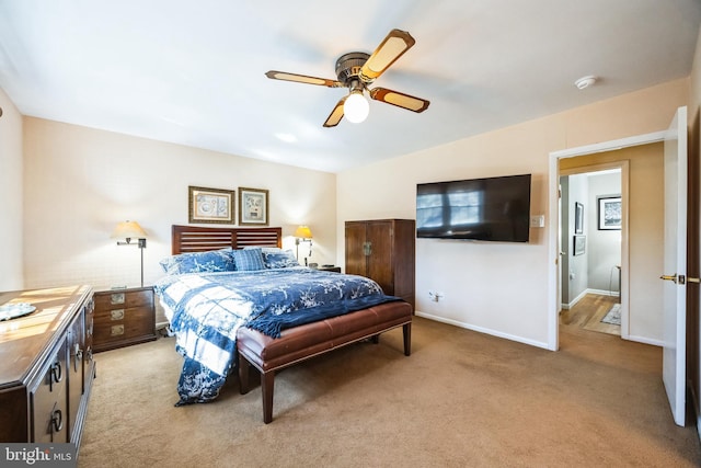 bedroom with a ceiling fan, lofted ceiling, light colored carpet, and baseboards