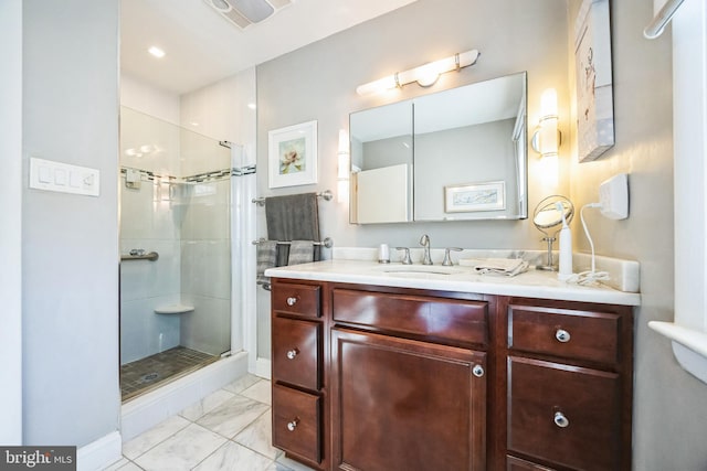 full bathroom featuring a stall shower, visible vents, marble finish floor, and vanity