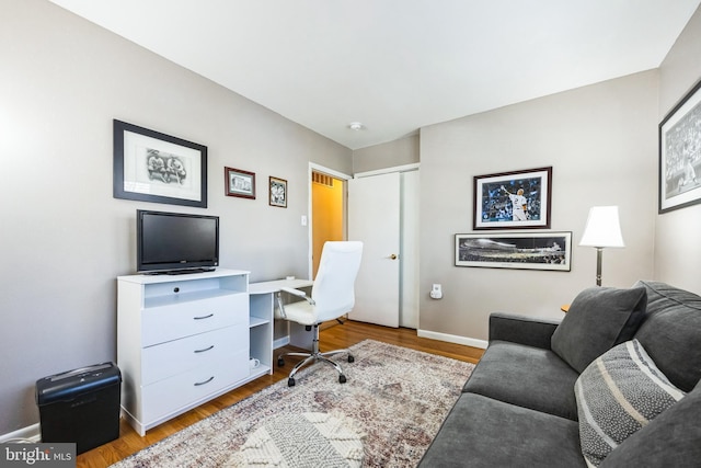 office space featuring light wood-style floors and baseboards