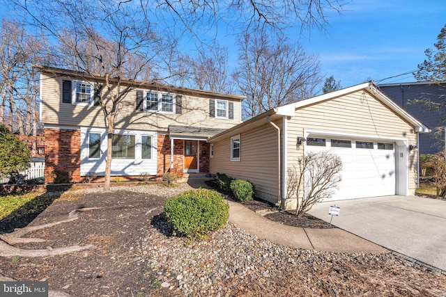 view of front of home with a garage, concrete driveway, and brick siding