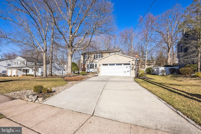 view of front of home featuring an attached garage, a chimney, a front lawn, and concrete driveway