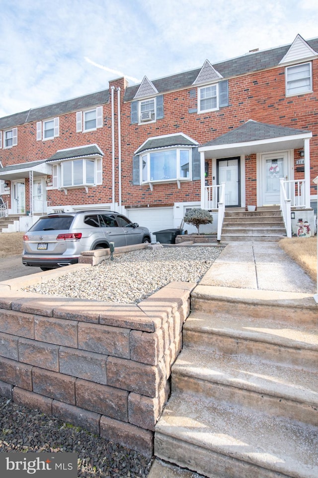 view of property featuring brick siding