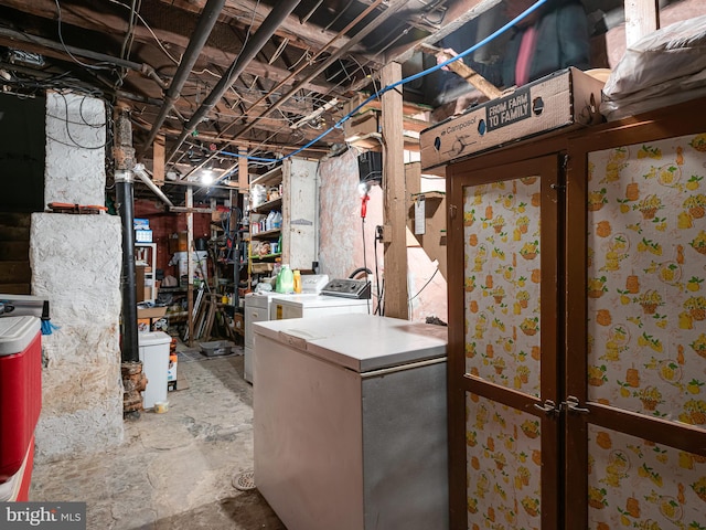 basement with refrigerator and washer and dryer