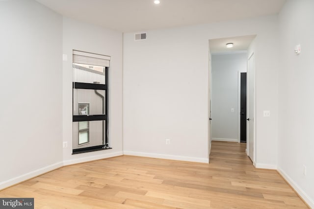 unfurnished room with light hardwood / wood-style floors