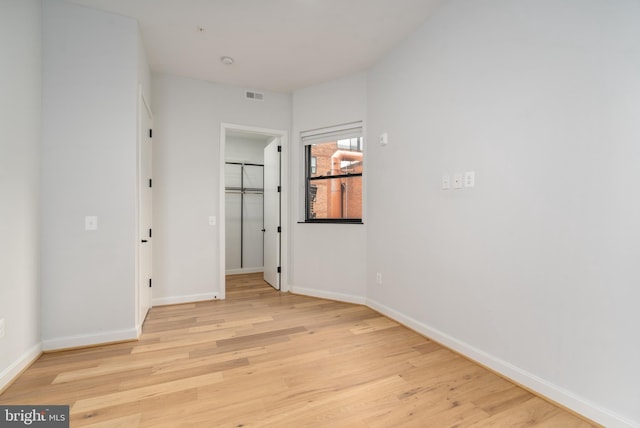 spare room featuring light wood-type flooring