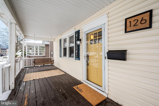 deck featuring covered porch