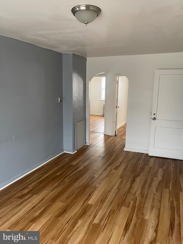 spare room featuring hardwood / wood-style floors