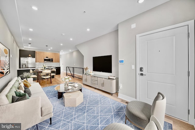 living room with light hardwood / wood-style flooring