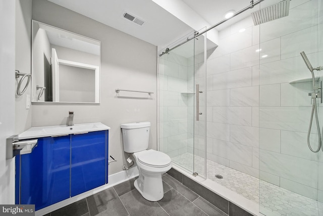 bathroom with vanity, an enclosed shower, and toilet